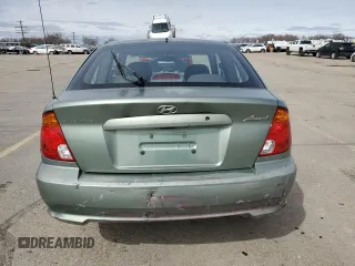 2003 Hyundai Accent GL with VIN KMHCG35C13U270585, listed as a Copart auction lot 50197935 with 53,822 mi miles and Salvage Title. Bid and sale history available at carsss.com. Image 6.