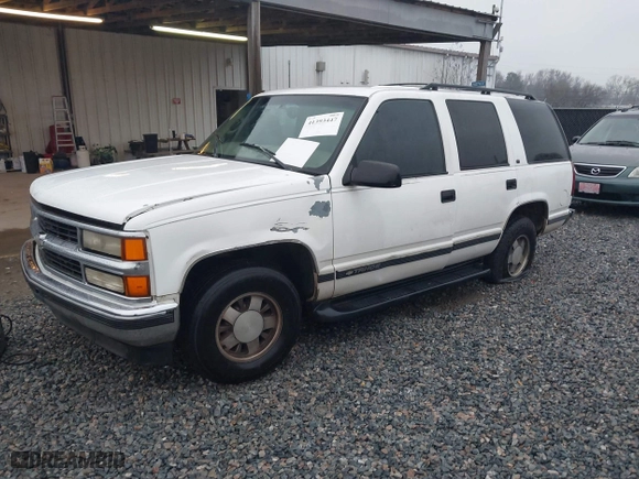 1999 Chevrolet Tahoe with VIN 1GNEC13RXXR101766, listed as a IAAI auction lot 41393447 with 387,448 mi miles. Bid and sale history available at carsss.com. Image 2.