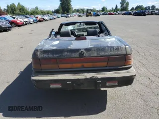 1992 Chrysler LeBaron z VIN 1C3XU4537NF129794, wystawiony jako Copart lot #71594804 z przebiegiem 156 624 mil mil oraz Szkody całkowita. Historia ofert i sprzedaży dostępna na DreamBid. Obrazek 6.