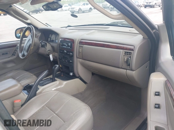 2004 Jeep Grand Cherokee Limited with VIN 1J4GX58SX4C255363, listed as a IAAI auction lot 42619798 with 239,475 mi miles and . Bid and sale history available at DreamBid. Image 5.