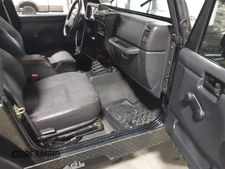 2002 Jeep Wrangler Sport with VIN 1J4FA49S02P704741, listed as a IAAI auction lot 41759558 with 191,126 mi miles. Bid and sale history available at carsss.com. Image 5.