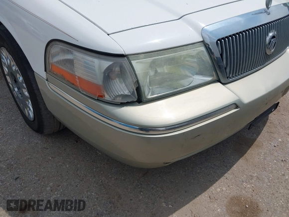 2004 Mercury Grand Marquis GS z VIN 2MEFM74W54X654116, wystawiony jako IAAI lot #41875021 z przebiegiem 129 999 mil mil oraz . Historia ofert i sprzedaży dostępna na DreamBid. Obrazek 6.