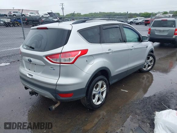 2013 Ford Escape SE with VIN 1FMCU9G94DUC52497, listed as a IAAI auction lot 42352704 with 194,648 mi miles and . Bid and sale history available at DreamBid. Image 4.