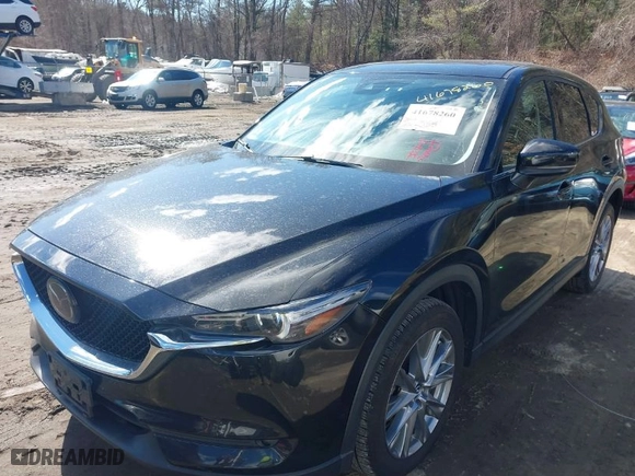 2021 Mazda CX-5 Grand Touring with VIN JM3KFBDM3M1318248, listed as a IAAI auction lot 41678260 with 71,903 mi miles. Bid and sale history available at carsss.com. Image 2.