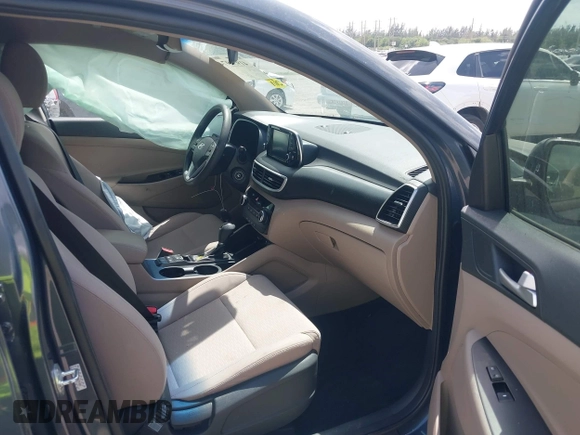 2021 Hyundai Tucson SE with VIN KM8J23A41MU291085, listed as a IAAI auction lot 41956974 with 93,932 mi miles. Bid and sale history available at carsss.com. Image 5.