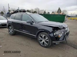 2017 Volkswagen Touareg Wolfsburg Edition with VIN WVGRF7BP9HD006520, listed as a Copart auction lot 84168634 with 76,596 mi miles and Salvage title. Bid and sale history available at DreamBid. Image 4.
