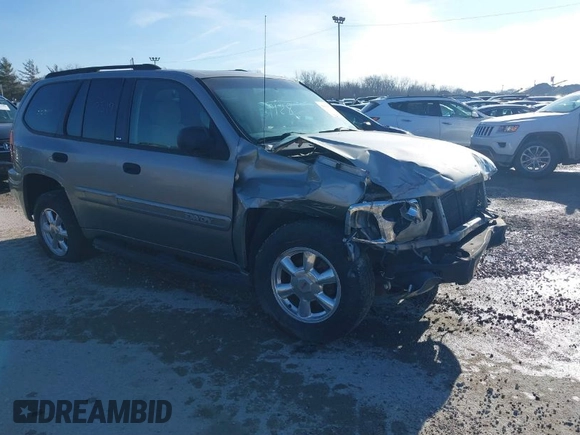 2003 GMC Envoy SLE with VIN 1GKDT13S732168534, listed as a IAAI auction lot 38049193 with 230,894 mi miles. Bid and sale history available at carsss.com. Image 1.