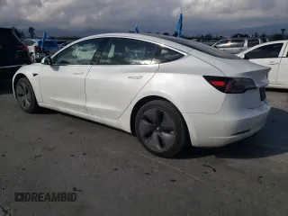 2019 Tesla Model 3 Mid Range with VIN 5YJ3E1EA5KF485116, listed as a Copart auction lot 49289295 with 39,911 mi miles and Salvage Title. Bid and sale history available at DreamBid. Image 2.