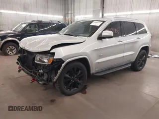2011 Jeep Grand Cherokee Laredo with VIN 1J4RR4GGXBC684171, listed as a IAAI auction lot 41889727 with 141,202 mi miles and . Bid and sale history available at DreamBid. Image 2.