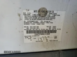 2011 Ford Taurus Limited with VIN 1FAHP2FW8BG141839, listed as a Copart auction lot 56594285 with 121,236 mi miles and Salvage title. Bid and sale history available at DreamBid. Image 13.