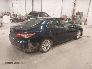 2020 Toyota Camry LE with VIN 4T1C11AK5LU926564, listed as a IAAI auction lot 41864812 with 104,212 mi miles and . Bid and sale history available at carsss.com. Image 4.