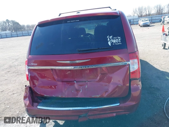 2013 Chrysler Town & Country Touring z VIN 2C4RC1BG7DR777172, wystawiony jako IAAI lot #41780881 z przebiegiem 196 768 mil mil oraz . Historia ofert i sprzedaży dostępna na DreamBid. Obrazek 19.