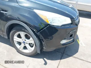 2014 Ford Escape SE z VIN 1FMCU0G96EUD57930, wystawiony jako IAAI lot #42347567 z przebiegiem 169 128 mil mil oraz . Historia ofert i sprzedaży dostępna na DreamBid. Obrazek 6.