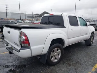 2009 Toyota Tacoma PreRunner with VIN 3TMJU62NX9M078106, listed as a IAAI auction lot 41768489 with 83,360 mi miles. Bid and sale history available at carsss.com. Image 4.
