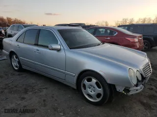 2000 Mercedes-Benz E-Class with VIN WDBJF70J7YB049473, listed as a Copart auction lot 82396624 with 197,515 mi miles and Salvage Title. Bid and sale history available at carsss.com. Image 4.