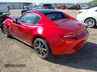 2020 Mazda MX-5 Miata Grand Touring z VIN JM1NDAM77L0418499, wystawiony jako IAAI lot #42010802 z przebiegiem 19 588 mil mil oraz . Historia ofert i sprzedaży dostępna na DreamBid. Obrazek 3.
