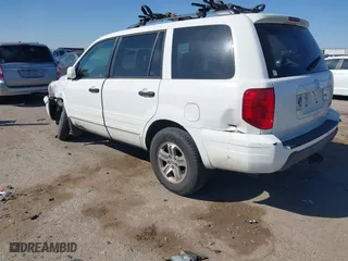 2005 Honda Pilot EX-L with NAVI with VIN 2HKYF18775H571312, listed as a IAAI auction lot 41830609 with 297,923 mi miles. Bid and sale history available at carsss.com. Image 3.