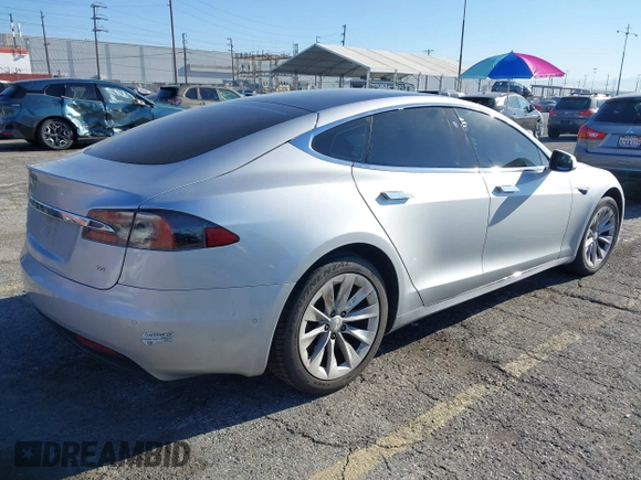 2017 Tesla Model S 60 with VIN 5YJSA1E12HF195741, listed as a IAAI auction lot 41861327 with 172,011 mi miles and . Bid and sale history available at DreamBid. Image 4.