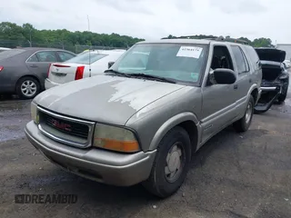 1999 GMC Jimmy SLE z VIN 1GKCS13W0X2512048, wystawiony jako IAAI lot #42364175 z przebiegiem 195 301 mil mil oraz . Historia ofert i sprzedaży dostępna na DreamBid. Obrazek 2.