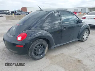 2010 Volkswagen New Beetle Coupe with VIN 3VWPG3AG9AM015051, listed as a IAAI auction lot 42052771 with 163,728 mi miles. Bid and sale history available at carsss.com. Image 4.