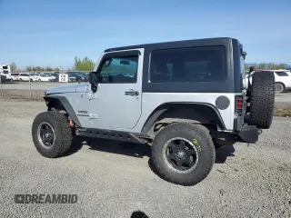 2012 Jeep Wrangler Sport z VIN 1C4AJWAG3CL151885, wystawiony jako Copart lot #51682175 z przebiegiem 111 544 mil mil oraz Szkoda całkowita • Salvage title. Historia ofert i sprzedaży dostępna na DreamBid. Obrazek 2.