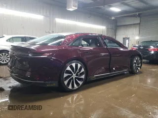 2022 Lucid Air Grand Touring z VIN 50EA1GBA0NA001260, wystawiony jako Copart lot #52131155 z przebiegiem 25 673 mil mil oraz Szkody całkowita. Historia ofert i sprzedaży dostępna na DreamBid. Obrazek 3.