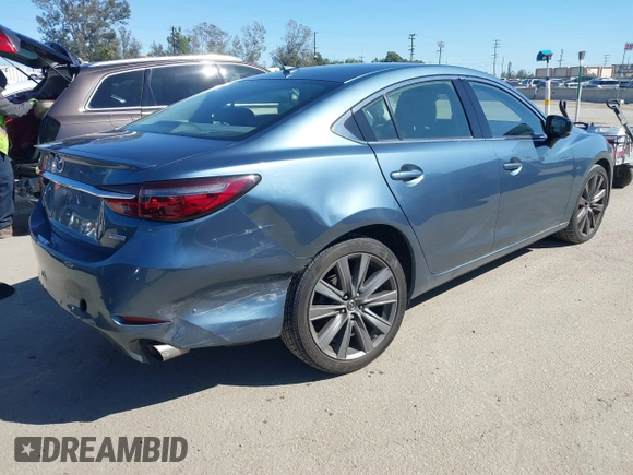 2018 Mazda 6 Grand Touring with VIN JM1GL1TY4J1333021, listed as a IAAI auction lot 41818719 with 56,188 mi miles and . Bid and sale history available at DreamBid. Image 4.