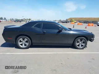2016 Dodge Challenger SXT Plus z VIN 2C3CDZAG4GH184435, wystawiony jako IAAI lot #42162973 z przebiegiem 168 495 mil mil oraz . Historia ofert i sprzedaży dostępna na DreamBid. Obrazek 13.