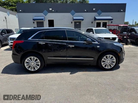 2018 Cadillac XT5 Premium Luxury FWD z VIN 1GYKNERS6JZ139813, wystawiony jako Copart lot #57681285 z przebiegiem 96 567 mil mil oraz Nie do naprawy. Historia ofert i sprzedaży dostępna na DreamBid. Obrazek 13.