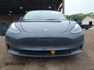 2023 Tesla Model 3 with VIN 5YJ3E1EA9PF673399, listed as a IAAI auction lot 42392643 with 7,571 mi miles and . Bid and sale history available at DreamBid. Image 13.