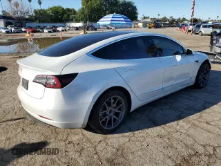 2020 Tesla Model 3 Standard Range Plus with VIN 5YJ3E1EA5LF660417, listed as a Copart auction lot 48144125 with 112,924 mi miles and Salvage Title. Bid and sale history available at DreamBid. Image 3.