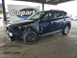 2014 Mazda CX-5 Touring with VIN JM3KE2CY4E0364279, listed as a Copart auction lot 62069605 with 102,756 mi miles and Salvage title. Bid and sale history available at DreamBid. Image 1.