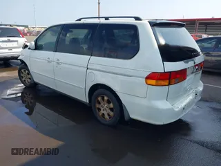 2002 Honda Odyssey EX z VIN 2HKRL18632H556791, wystawiony jako IAAI lot #41562553 z przebiegiem 222 976 mil mil oraz . Historia ofert i sprzedaży dostępna na DreamBid. Obrazek 3.