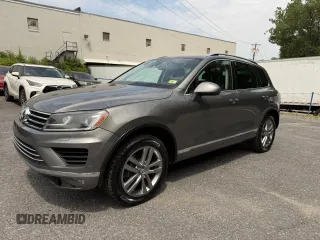 2016 Volkswagen Touareg Sport с VIN WVGEF9BP9GD007210, выставлен на аукционе Copart как лот 61608015 с пробегом 192 156 миль миль и Чистый • Clean title. История ставок и продаж доступна на DreamBid. Изображение 2.