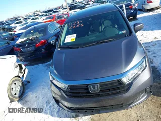 2023 Honda Odyssey Touring with VIN 5FNRL6H80PB005769, listed as a IAAI auction lot 41280858 with 7,041 mi miles and . Bid and sale history available at DreamBid. Image 12.