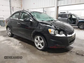 2012 Chevrolet Sonic LTZ z VIN 1G1JE5SH0C4175506, wystawiony jako IAAI lot #41448791 z przebiegiem 100 126 mil mil oraz . Historia ofert i sprzedaży dostępna na DreamBid. Obrazek 1.