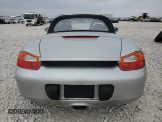 2001 Porsche Boxster с VIN WP0CA29821U621779, выставлен на аукционе Copart как лот 87204984 с пробегом 82 091 миль миль и Списание • Salvage title. История ставок и продаж доступна на DreamBid. Изображение 6.