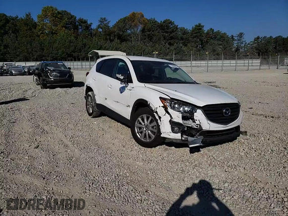 2016 Mazda CX-5 Touring with VIN JM3KE2CY6G0896040, listed as a Copart auction lot 78399684 with 98,639 mi miles and Salvage Title. Bid and sale history available at DreamBid. Image 12.