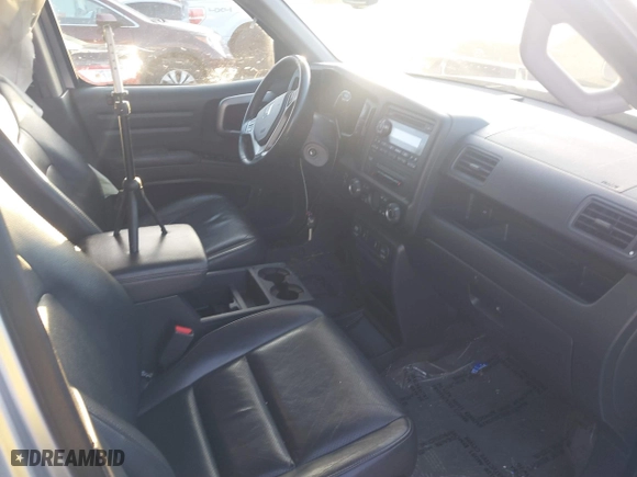 2014 Honda Ridgeline RTL with VIN 5FPYK1F57EB009199, listed as a IAAI auction lot 41208488 with 100,340 mi miles. Bid and sale history available at carsss.com. Image 5.