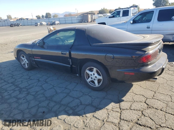 1999 Pontiac Firebird Firebird z VIN 2G2FS22K6X2208489, wystawiony jako Copart lot #79930994 z przebiegiem 181 964 mil mil oraz Czysty tytuł • Clean title. Historia ofert i sprzedaży dostępna na DreamBid. Obrazek 2.
