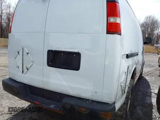 2014 Chevrolet Express Cargo Van with VIN 1GCWGFCA0E1205946, listed as a IAAI auction lot 41685687 with 317,212 mi miles. Bid and sale history available at carsss.com. Image 4.