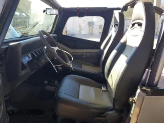 1994 Jeep Wrangler with VIN 1J4FY29S4RP471828, listed as a Copart auction lot 87893385 with 210,743 mi miles and Salvage Title. Bid and sale history available at carsss.com. Image 7.