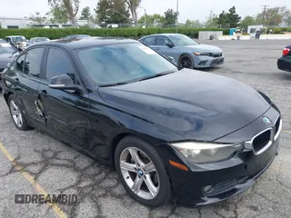 2014 BMW 3 Series 320i with VIN WBA3B1G57ENS80800, listed as a IAAI auction lot 42097683 with 152,924 mi miles. Bid and sale history available at carsss.com. Image 1.
