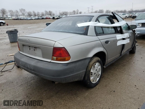 1998 Saturn SL z VIN 1G8ZG5288WZ306574, wystawiony jako Copart lot #86627384 z przebiegiem Nie podano mil oraz Nie do naprawy. Historia ofert i sprzedaży dostępna na DreamBid. Obrazek 3.