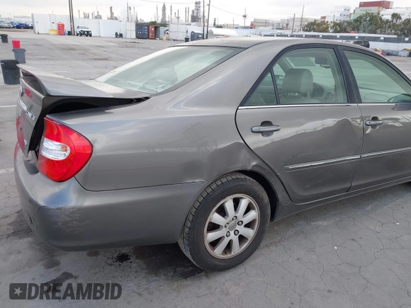 2004 Toyota Camry LE with VIN 4T1BF32K84U588764, listed as a IAAI auction lot 42126345 with 144,642 mi miles. Bid and sale history available at carsss.com. Image 6.