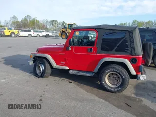2003 Jeep Wrangler Sport with VIN 1J4FA49S13P320159, listed as a IAAI auction lot 41935699 with 212,355 mi miles. Bid and sale history available at carsss.com. Image 14.