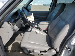 2000 Ford Explorer XLT with VIN 1FMZU83PXYZA71034, listed as a Copart auction lot 55447585 with 175,118 mi miles and Salvage title. Bid and sale history available at DreamBid. Image 7.