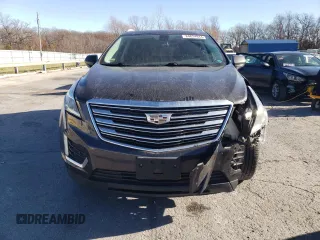 2017 Cadillac XT5 Premium Luxury FWD z VIN 1GYKNCRS2HZ114664, wystawiony jako Copart lot #84624944 z przebiegiem 153 882 mil mil oraz Szkody całkowita. Historia ofert i sprzedaży dostępna na DreamBid. Obrazek 5.