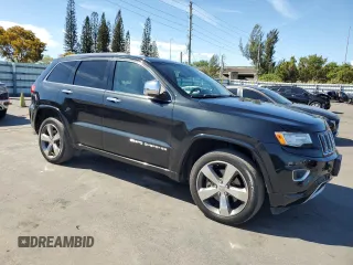 2015 Jeep Grand Cherokee Overland with VIN 1C4RJFCT6FC628729, listed as a Copart auction lot 50192705 with 106,102 mi miles and Salvage Title. Bid and sale history available at carsss.com. Image 4.