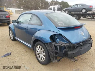2019 Volkswagen Beetle S with VIN 3VWFD7AT8KM708865, listed as a IAAI auction lot 41692756 with 35,070 mi miles. Bid and sale history available at carsss.com. Image 3.